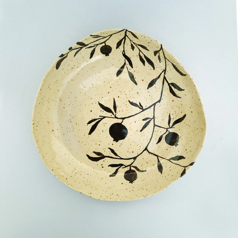 Handmade large ceramic bowl, delicately hand-painted with an elegant pomegranate plant in black.